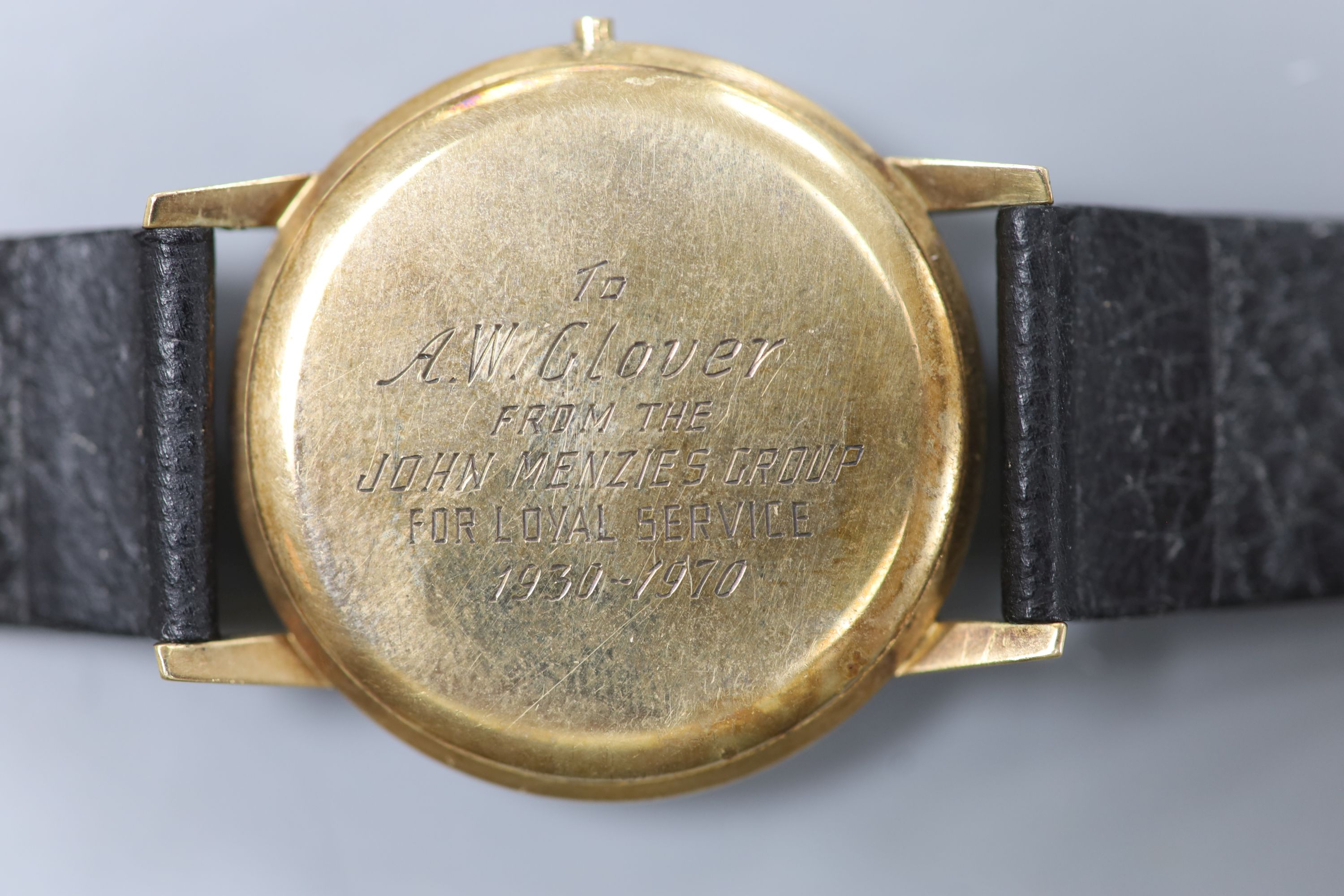 A gentleman's 1960's 9ct gold Longines manual wind wrist watch (lacking winding crown), with case back inscription.